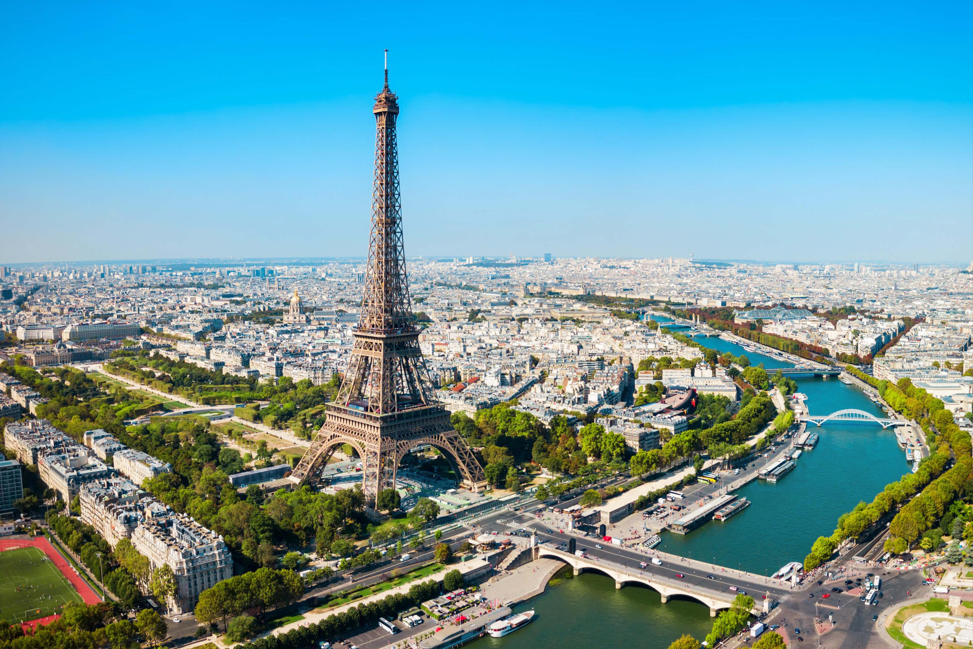 Eiffel Tower towering over the Seine River in Paris, France, showcasing the city's iconic skyline and European charm