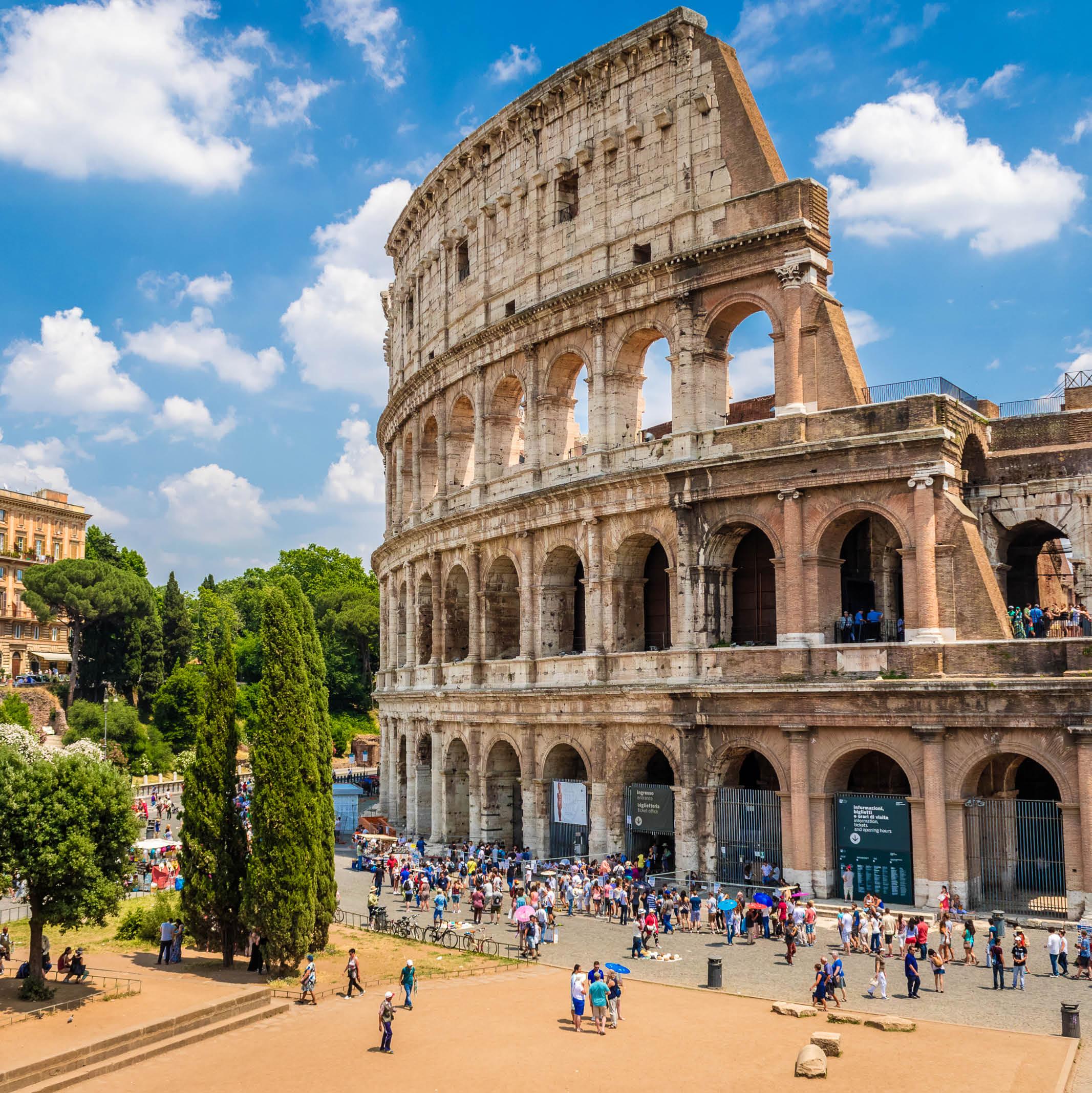 Tourists outside of the ancient Colosseum in Rome