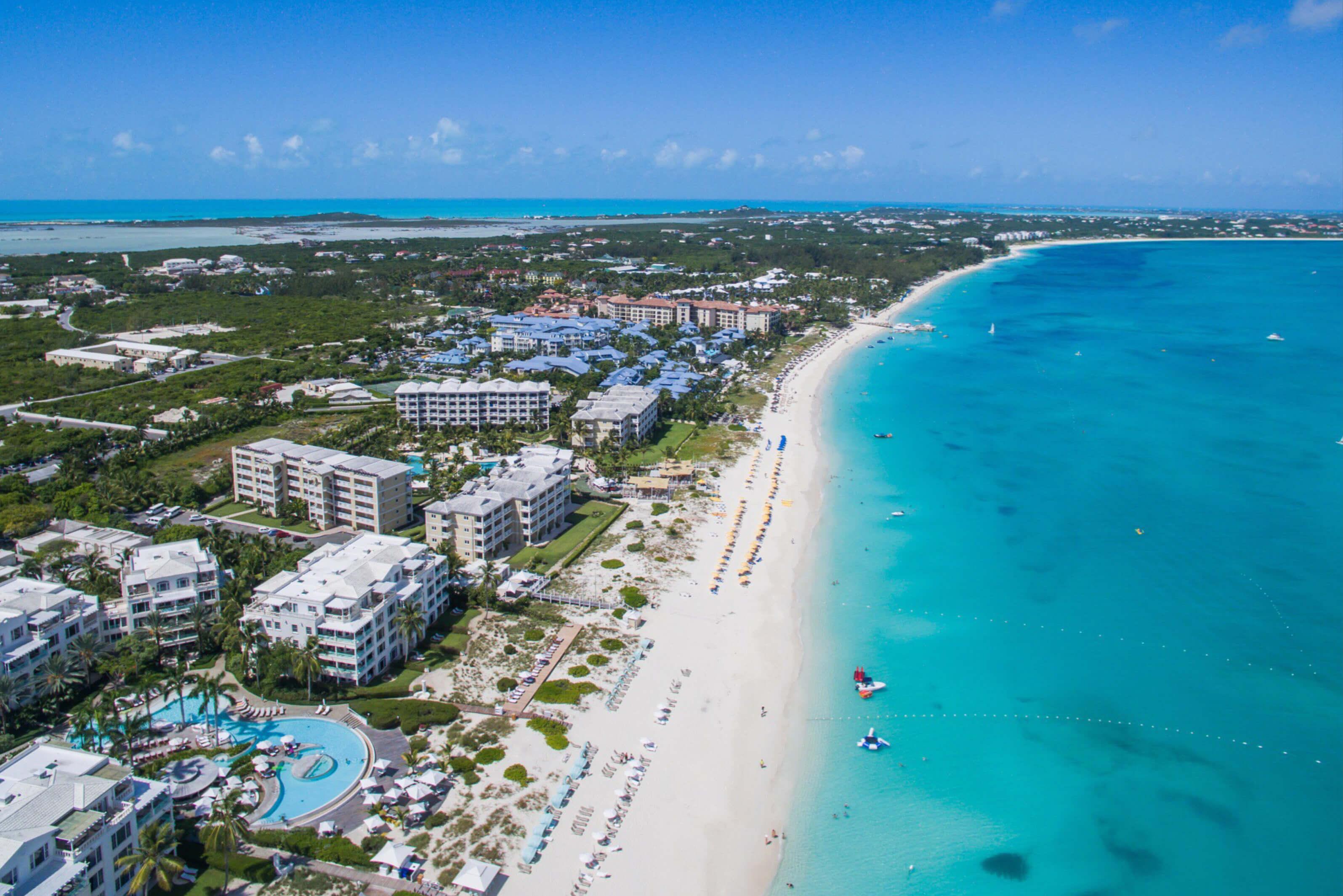 Immaculate shoreline in Turks and Caicos featuring many resorts