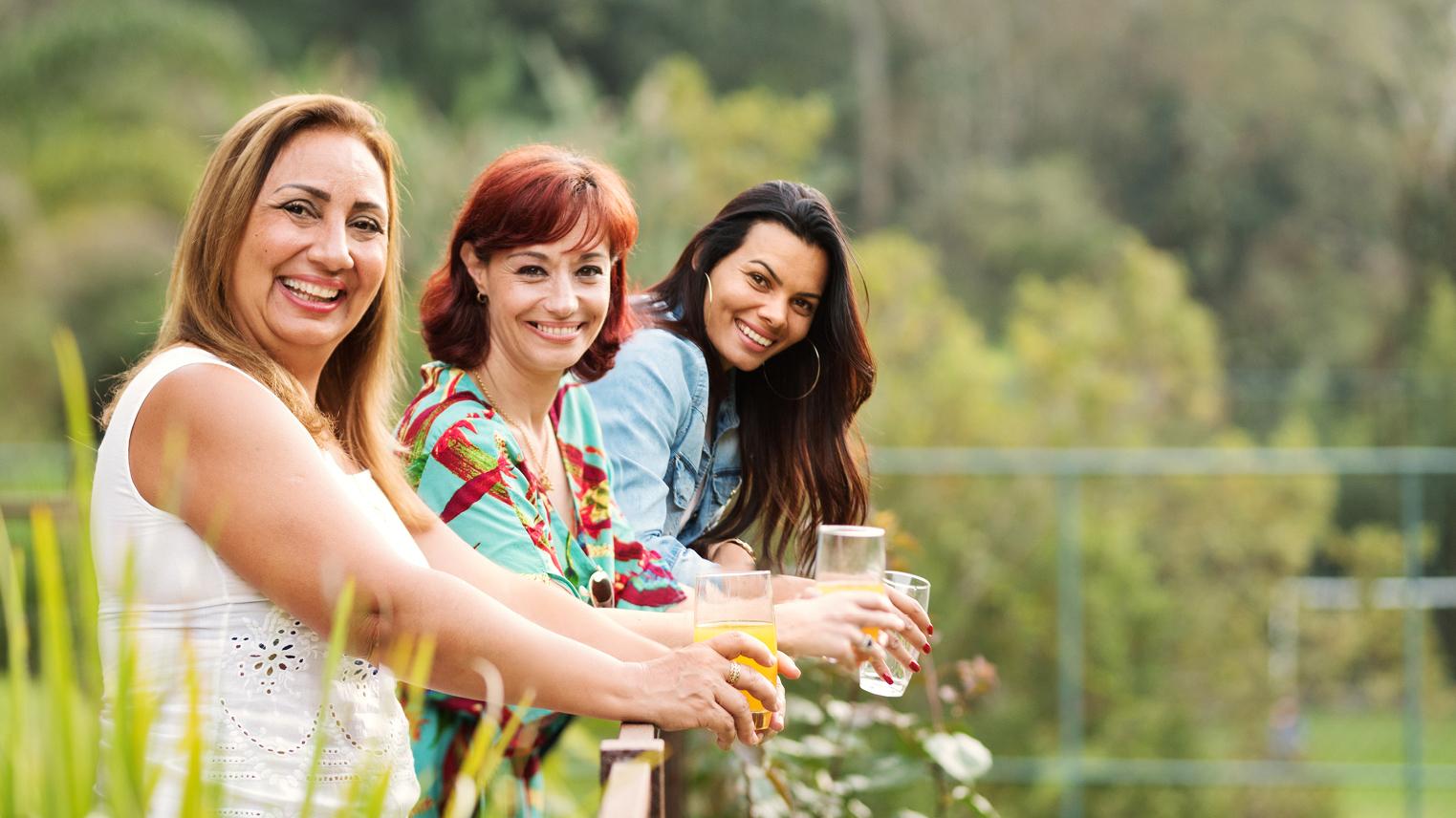 Female coworkers enjoy a beverage on a team-building event